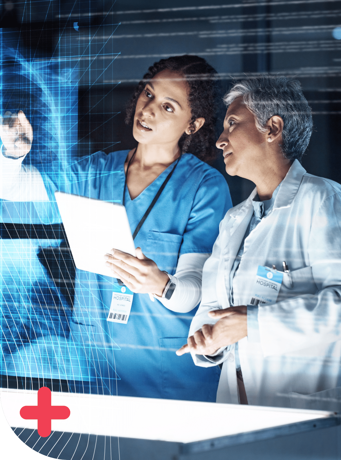 Two female medical professionals, a nurse and a doctor, review a digital, holographic medical scan.