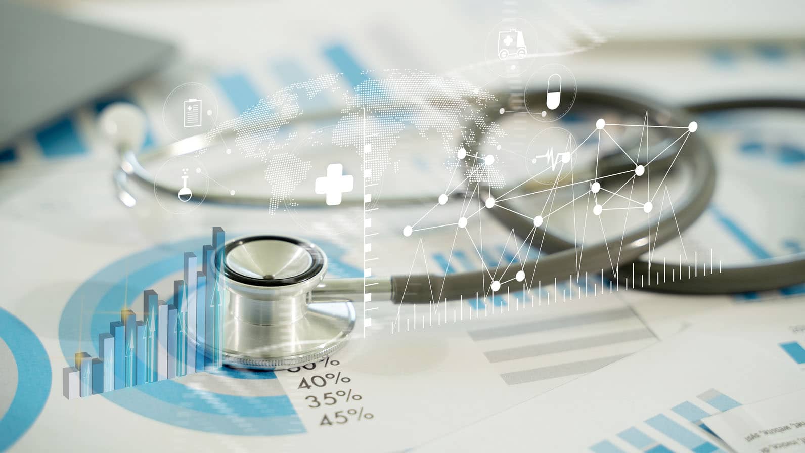 Data point graphics over stethoscope sitting on top of pages of pie charts.