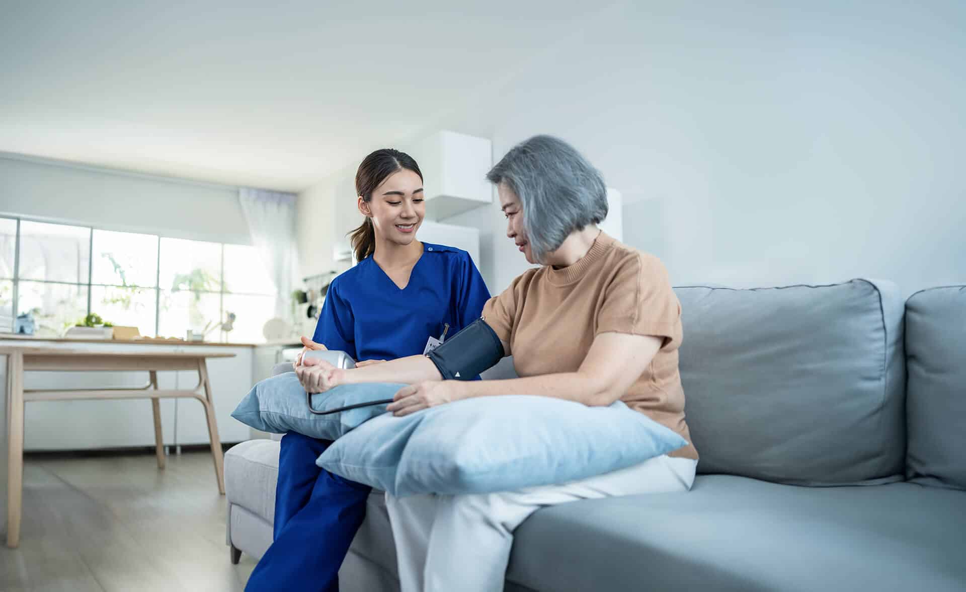 Physician with a patient checking health statistics